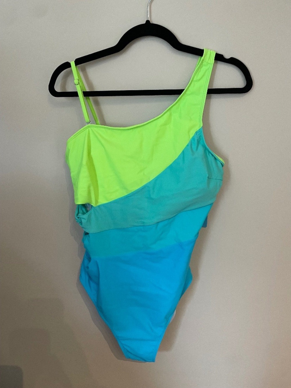 Multi colored one shoulder swimsuit with cut outs